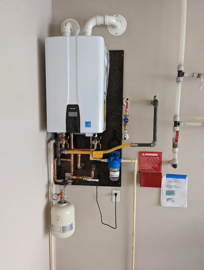 Professional plumber installing copper piping in a Frankfort home